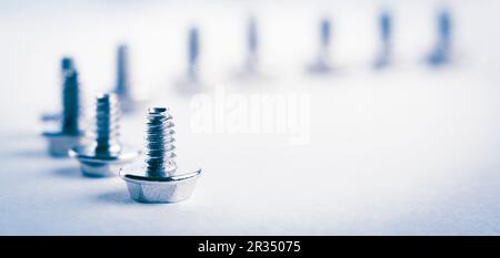 Abstract Shot Of Computer Screws On  Background Stock Photo