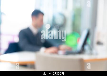 Blurred office background , office worker on the computer Stock Photo