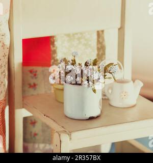 Forget-me-not in rustic cup Stock Photo