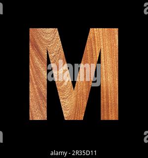 Capital letter M on oak wood background - Black background Stock Photo