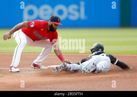 Chicago White Sox shortstop Luis Aparicio is still in air after firing ball  to first base