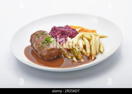 Beef roulade with potato orzo pasta and red cabbage Stock Photo