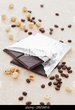 Dark chocolate, hazelnuts and coffee beans Stock Photo