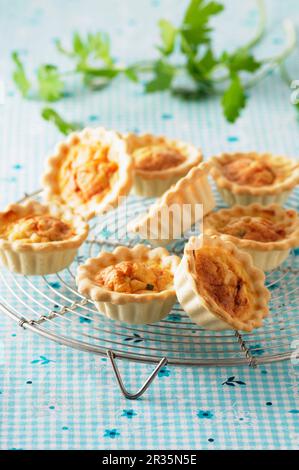 Spicy mini quiche on a cooling rack Stock Photo