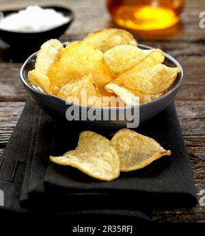 A bowl of sea salt and apple vinegar crisps Stock Photo