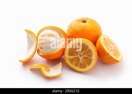 Bitter oranges, whole, halved and peeled Stock Photo