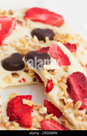 White chocolate with strawberries, dark chocolate and nuts Stock Photo