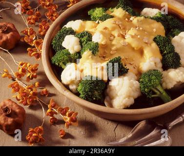 Cauliflower and broccoli with cheese sauce Stock Photo