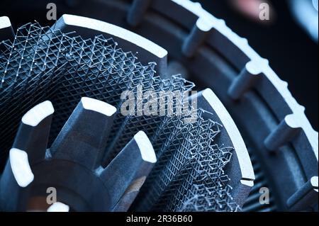 Complicated detail made by powder 3d printer in workshop Stock Photo