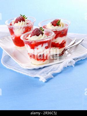 Layered desserts with cream cheese and strawberries Stock Photo