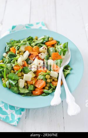 Lamb's lettuce with carrots, chickpeas and cheese Stock Photo