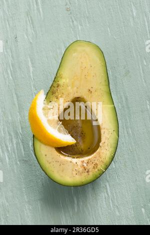 An avocado with olive oil and lemon Stock Photo
