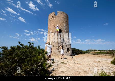 tourists visiting Cap Blanc tower built in 1579, llucmajor, Mallorca, Balearic Islands, Spain. Stock Photo