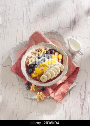 A banana and acai berry smoothie bowl Stock Photo