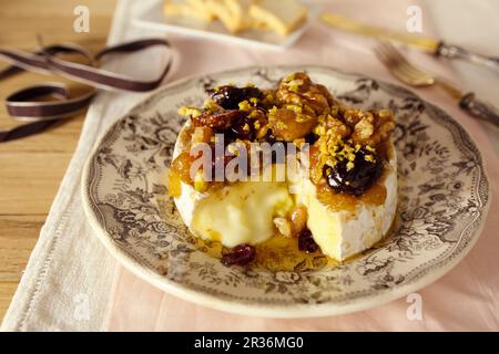 Baked Camembert with dried fruit compote Stock Photo