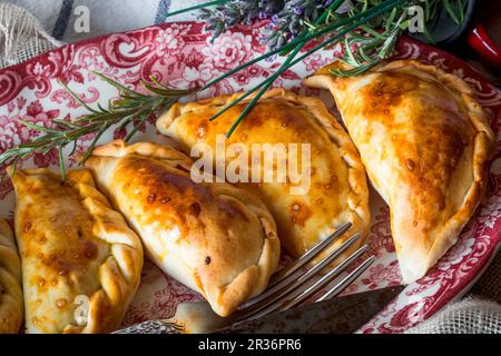 A plate of Spanish pasties filled with meat and tuna Stock Photo