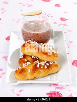 Small brioches with figs and a smoothie Stock Photo