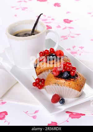 Small berry cakes and coffee Stock Photo