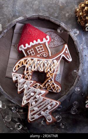 Christmas gingerbread biscuits (shaped like a Christmas tree, horse and house) Stock Photo