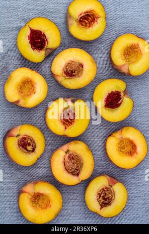 Several nectarine halves (seen from above) Stock Photo