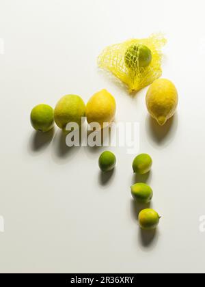 Several organic lemons and limes Stock Photo