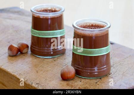 Chocolate and hazelnut flan in glasses Stock Photo