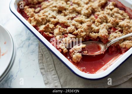 Strawberry and rhubarb crumble Stock Photo