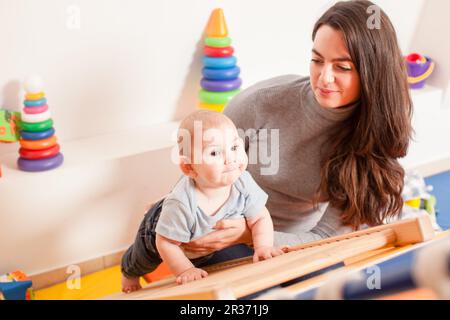 Interaction between mother and baby Stock Photo