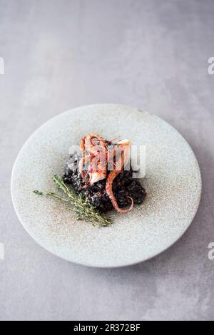 Black risotto with squid Stock Photo