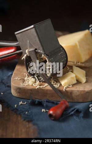 A Rotary Cheese Grater On A Round Sheep Cheese Stock Photo - Download Image  Now - Blade, Business, Cafe - iStock