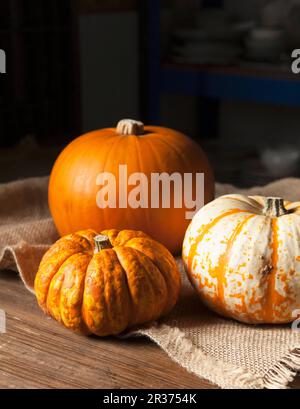 Various pumpkins on a jute cloth Stock Photo
