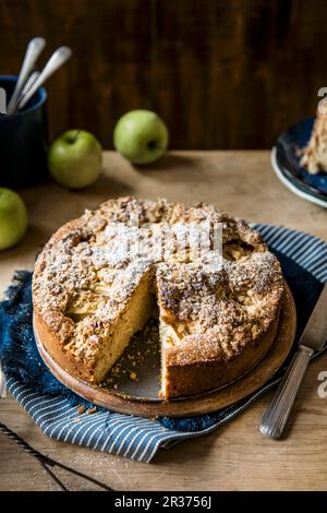 Apple cake with walnuts and oats crumble topping, slive removed Stock Photo