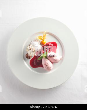 Cherry ice cream with cherry sauce Stock Photo