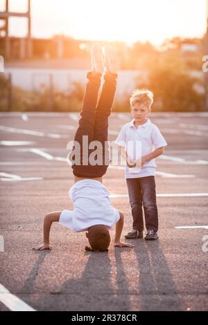The boy standing upside down Stock Photo