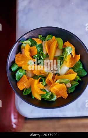Asparagus salad with oranges, mimolette and lambs lettuce Stock Photo