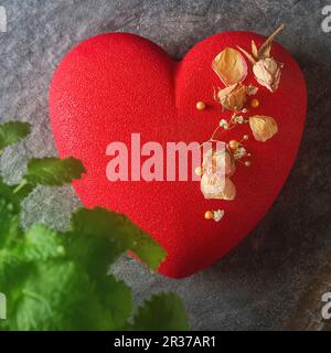 A romantic heart-shaped mousse cake for Valentine's Day Stock Photo