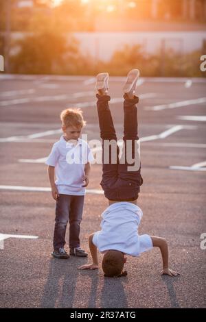 The boy standing upside down Stock Photo