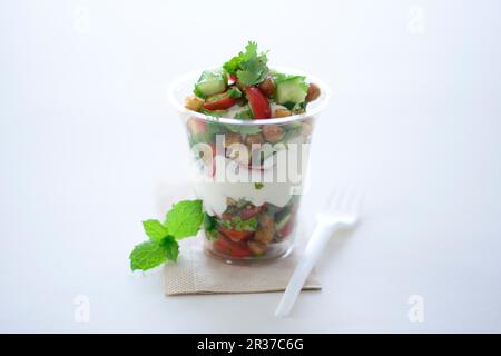 Garden salad with croutons and a yoghurt dressing in a takeaway cup Stock Photo