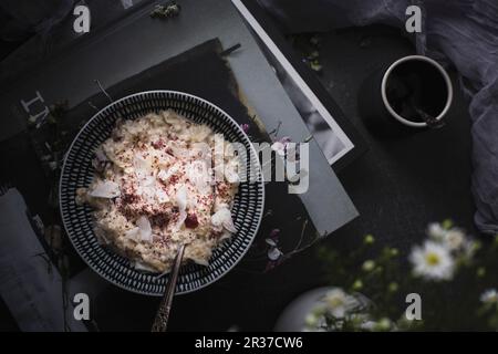 Overnight oats or bircher muesli with coconut and cranberries (Seen from above) Stock Photo