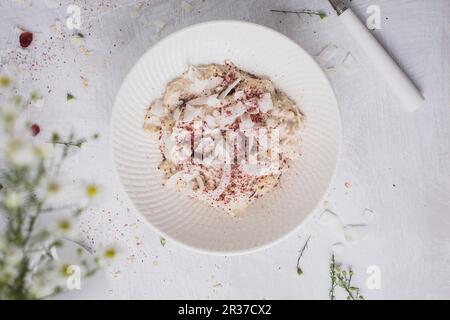 Overnight oats or bircher muesli with coconut and cranberries (Breakfast) seen from above Stock Photo
