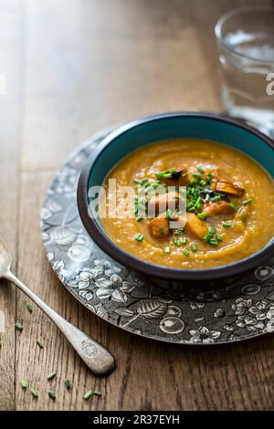 Roasted buternut squash soup with chives Stock Photo