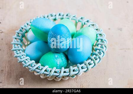 Dyed Easter eggs with batik patterns in a basket Stock Photo