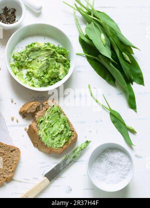 Spelt and sesame seed bread with wild garlic butter Stock Photo