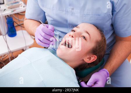 Dentist examines the teeth Stock Photo
