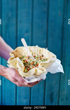 Tabouleh in a flatbread bowl Stock Photo