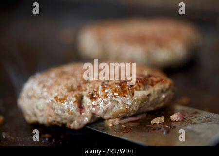 Hamburgers on a grill Stock Photo