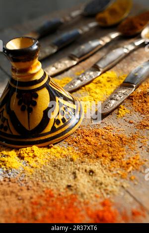 Various spices and poppy seeds on a table with oriental tableware Stock Photo