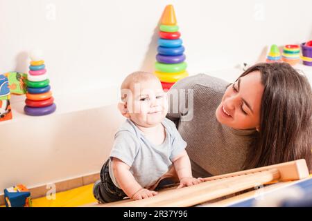 Interaction between mother and baby Stock Photo