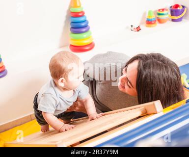 Interaction between mother and baby Stock Photo