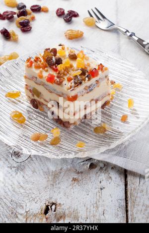 Colourful pieces of cake with dried fruits and nuts Stock Photo